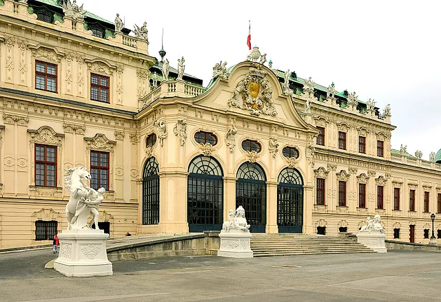 The entrance front of the Upper Belvedere with white stone sculptures